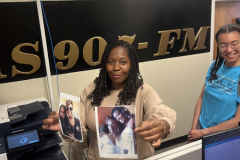 News Director Melanie Hogan (left) showing the field team photos from WVAS