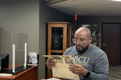 Vincentt Sutton reviewing archival materials